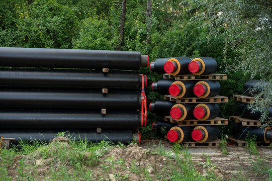 Outdoor Construction Storage of Pre-Insulated District Heating Pipes with Red Caps