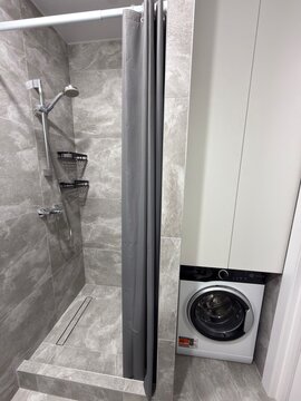 Modern Walk In Shower with Washing Machine in Contemporary Gray Bathroom