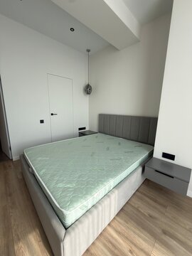 Modern Minimalist Bedroom with Upholstered Bed and Floating Nightstands