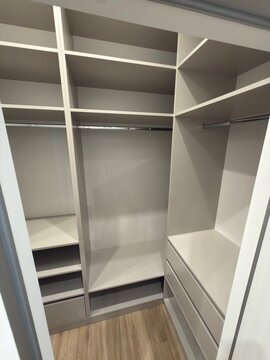 Modern Walk In Closet with Built In Shelving and Storage Drawers