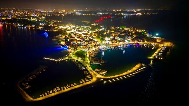Side, Turkey - July 13, 2026: Aerial drone night view of the old town in Side, Turkey, showing illuminated streets, historic coastal buildings, city lights, and the Mediterranean shoreline