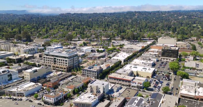 Burlingame California - Aerial Shot of Downtown Burlingame Area with Homes and Fog Rolling Over Hills in Distance 