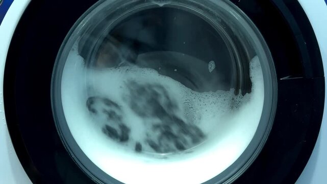 Close Up of Soap Foam in Washing Machine