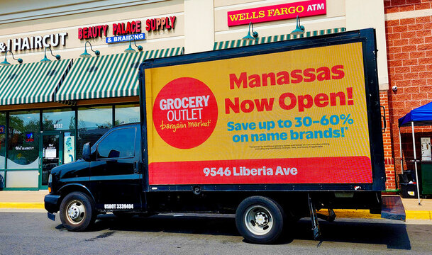 Advertising truck with Grocery Outlet store sign, Manassas, Virginia, USA