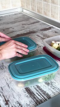 Closing Plastic Lids on Meal Prep Boxes