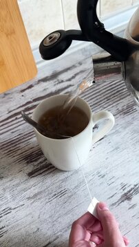 Brewing and Stirring Herbal Tea Close Up