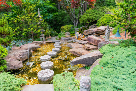 Stone Stepping Path Crossing Japanese Garden Stream In Tranquil Landscape