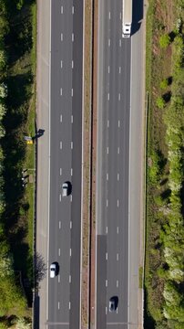 Aerial speeding cars from above on motorway with motion