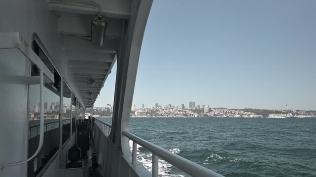 A scenic view from a passenger ferry cruising along the Bosphorus Strait in Istanbul, Turkey. 