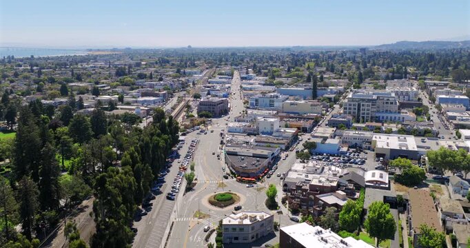 Burlingame California - Aerial Approach Over Roundabout Facing South with Restaurants and Shops Below