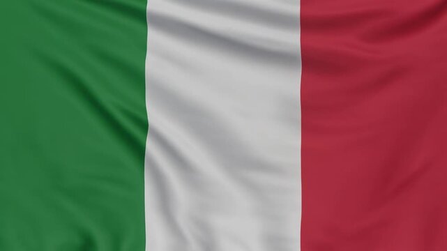 Italian flag with vertical green, white, and red stripes symbolizing unity, hope, and national pride fluttering softly in light.