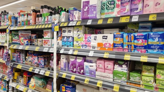 Feminine Hygiene and Household Care Products in Supermarket Aisle