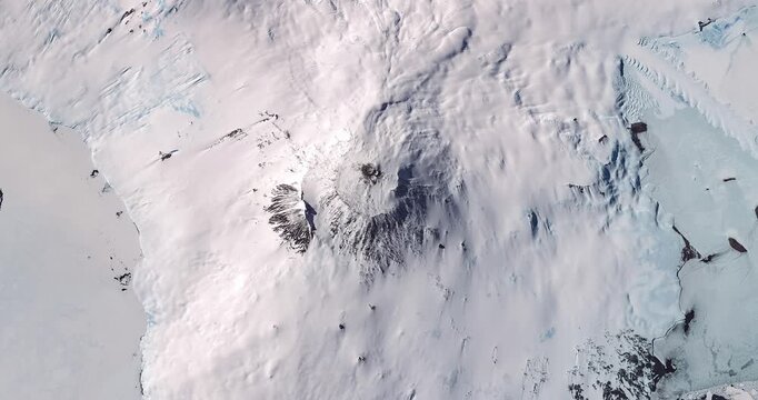 View on antarctic extinct volcano covered with snow. Camera is zooming out, rotating counterclockwise. Animation based on image by NASA
