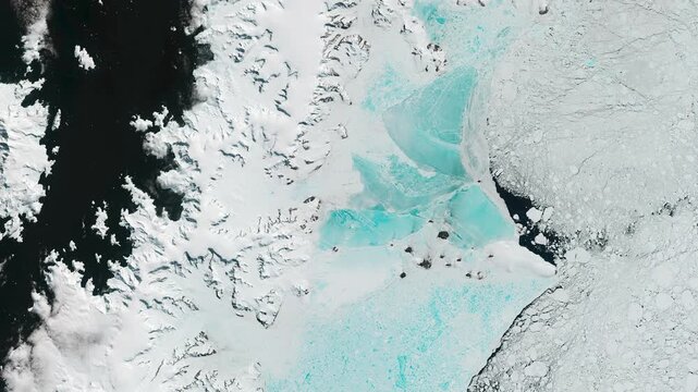 Panoramic top view of nunataks and melting ice. Glaciers and icebergs in ocean. Camera is moving backward and right. Animation based on image by NASA
