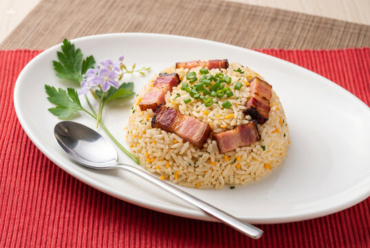 Delicious Fried Rice with Grilled Meat Garnish, Colorful Vegetables, and Elegant Food Presentation for Culinary Backgrounds and Restaurant Promotions
