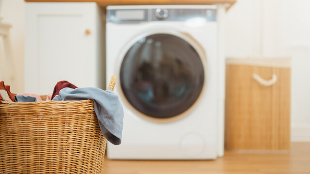 Laundry, lifestyle, and hygiene scene featuring clean and washing machine in a contemporary setting, efficiency, organized, residential, neat, everyday, utility, load, sanitation, chore.