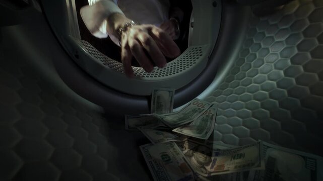 Conceptual video of an unrecognisable Caucasian man wearing a white shirt placing US dollar banknotes in a washing machine with his hands and taking them out in slow motion. Money Laundering Concept