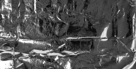 Obraz premium Silver foil textured background, crumpled aluminum pattern