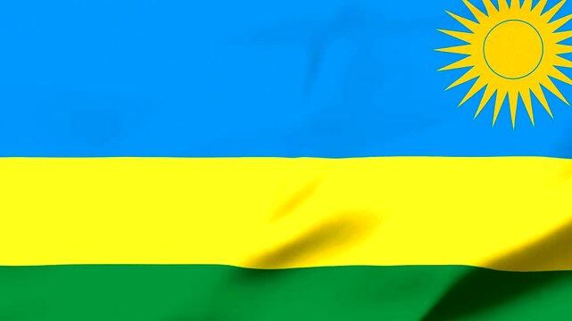 Rwandan flag with sun symbol waving in the wind