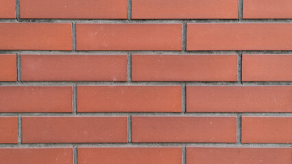 Obraz premium Red Brick Wall Texture Background with Dark Mortar Joints