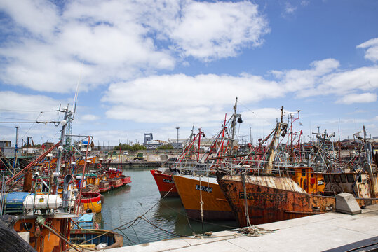 Mar del Plata , Buenos Airesz province , Argentina ; 12-20-2019 : Orange fishing ships docked in the port