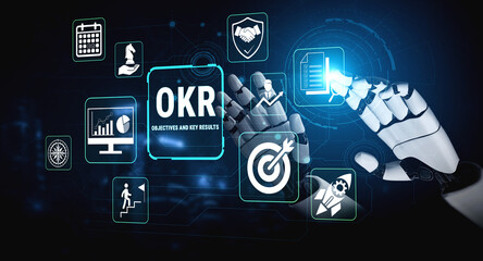 Naklejka premium Futuristic Robotic Hand Interacting with Digital Icons Representing OKR Objectives and Key Results in a High-Tech Setting Fluxor.