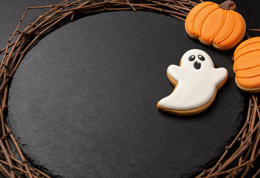 Halloween decor, ghost pumpkin ornament, autumn table centerpiece, halloween frame, ghost figure, pumpkin decor, seasonal arrangement, slate tray, twig wreath, spooky ornament, festive halloween.
