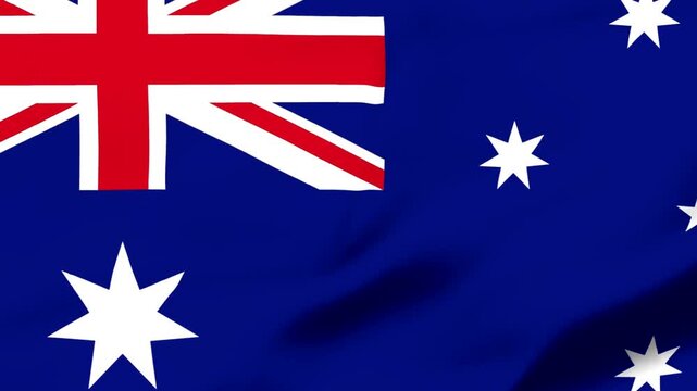 Australian flag waving in the wind with stars and union jack