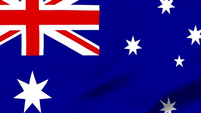 Australian flag waving in the wind with stars and union jack