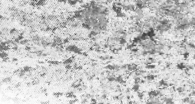 Abstract halftone radial background in grunge style. Monochrome distressed dot gradient pattern with messy scratches and circular texture. Halftone dotted grunge background. Vector backdrop
