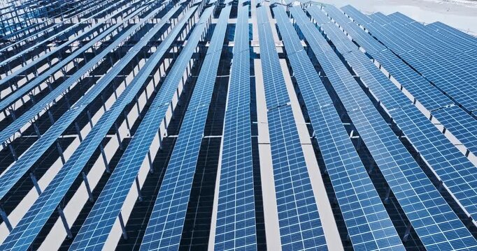 High-angle aerial shot of large solar panel array for renewable energy production. Perfect for clean power concepts.