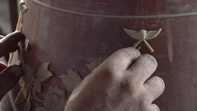 Artisan Hands Applying Wax Floral Ornament to Bell Casting Mold - 4K
