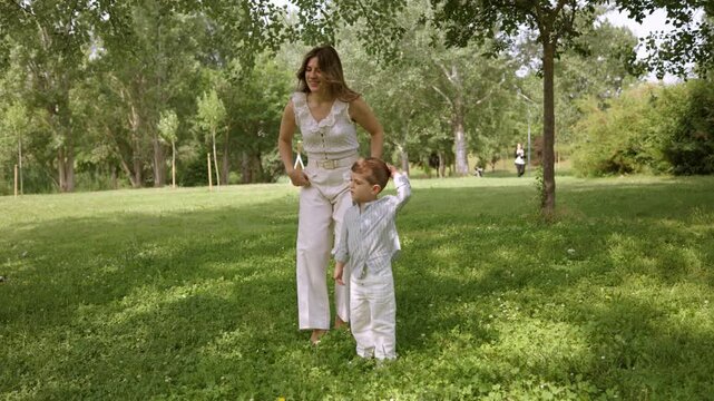 Mother and son enjoying sunny day in the park