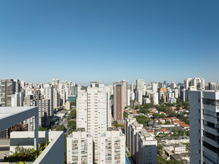 Fototapeta premium Aerial view of São Paulo's southern zone skyline with modern buildings and clear blue sky