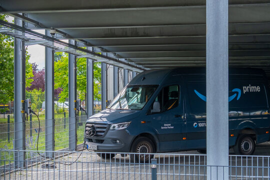 dark blue mercedes van charging, amazon e-commerce service partner logo electric vehicle infrastructure, sustainable logistics, green delivery fleet, commercial charging station, eco transport GERMANY
