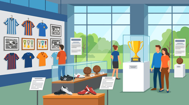 People visiting a sports museum exhibition with jerseys and trophies on display.