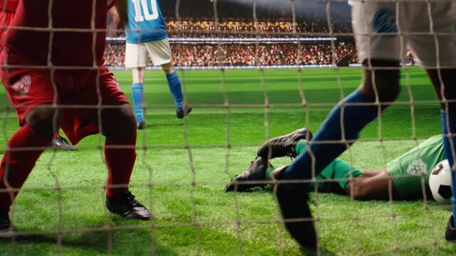 Defeated goalkeeper conceding goal and ball hitting net on pitch, beaten by striker in opposing team, happy successful opponents celebrating winning goal in stadium match, for football match content.