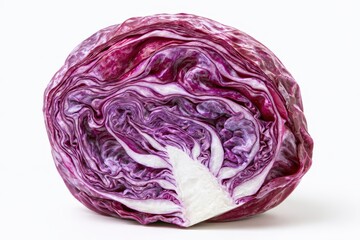 Obraz premium A halved red cabbage showcasing its dense, layered interior and white core, isolated on white background
