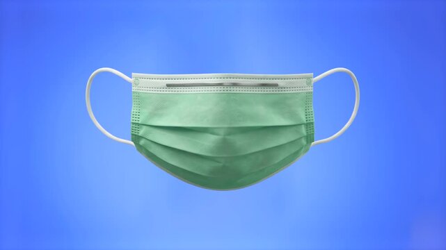 A realistic 3D model of a protective surgical face mask floating horizontally against a solid royal blue background. Perfect for medical promo videos, healthcare marketing, safety guidelines, virus pr