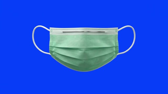 A 3D render of a light green medical face mask floating against a solid blue screen background. Ideal for healthcare educational videos, virus prevention infographics, medical safety graphics, and chr