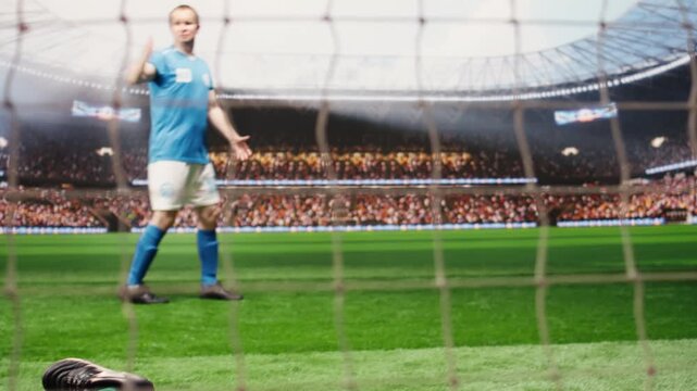 Defeated goalkeeper conceding goal and ball hitting net on pitch, beaten by striker in opposing team, happy successful opponents celebrating winning goal.