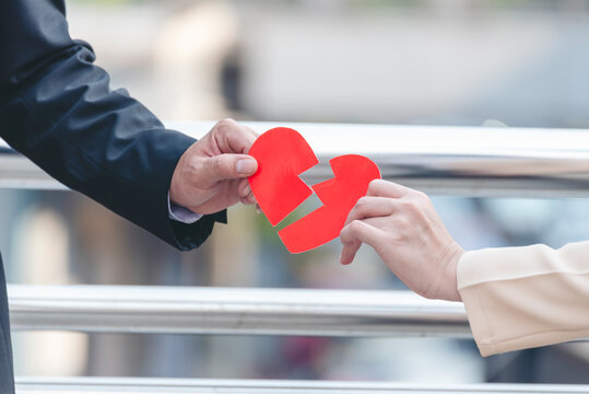 Two hand holding broken heart relationship couple breakup distress emotional. Divorce family separation grief despair. Arguing conflict loneliness broken heart relationship. Stress mental burnout