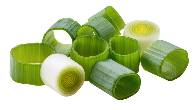 Isolated fresh vibrant green and white chopped leek slices and green onion rings arranged.