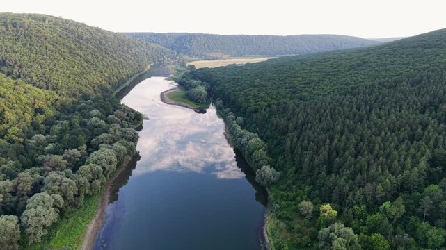 Discover the beauty of Dniester River winding through canyons and forests in Ukraine during summer with stunning aerial views