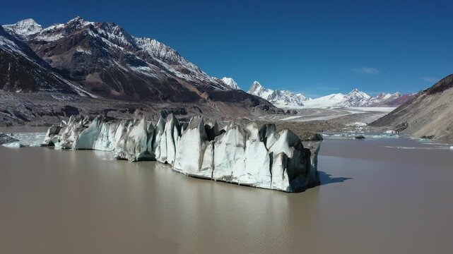 Aerial view of the massive blue ice wall at Laigu Glacier in Tibet, China
