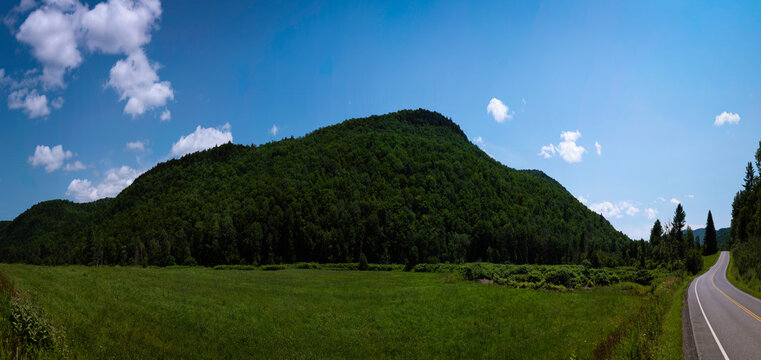 Panoramic New England summer road travel landscape of Braintree Mountains and Roxbury State Forest meadows in Granville, Addison County, Vermont, USA