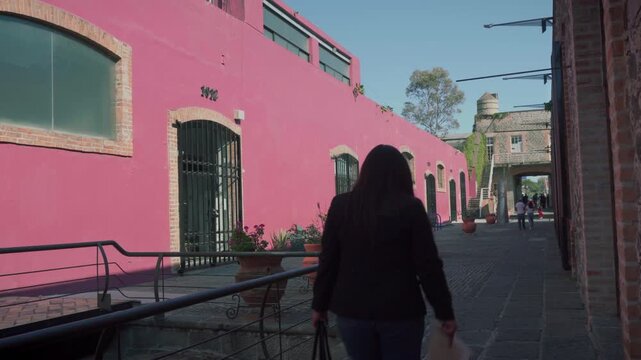 Hand held camera documentation of civil registry courthouse interior with visitors in historic Puebla architecture