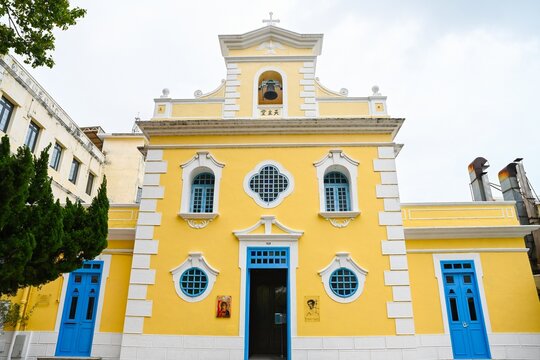 Macau, China April 14 2026 Facade of Chapel of St Francis Xavier historic baroque colonial church in Coloane Village under cloudy sky