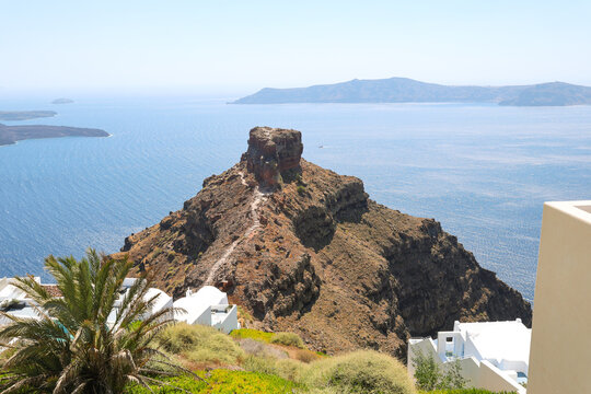 Scenic view of Skaros Rock rising above the Santorini caldera near Imerovigli in Greece. 
