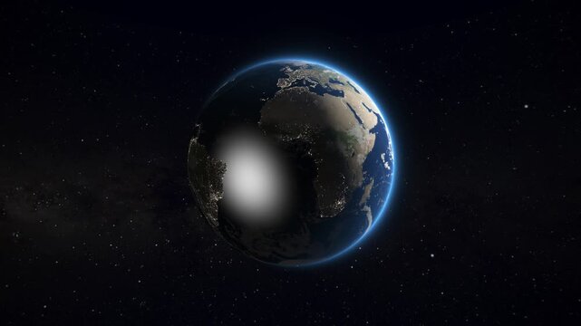 The planet Earth rotates slowly in the darkness of deep space, revealing continents transitioning from night to day.